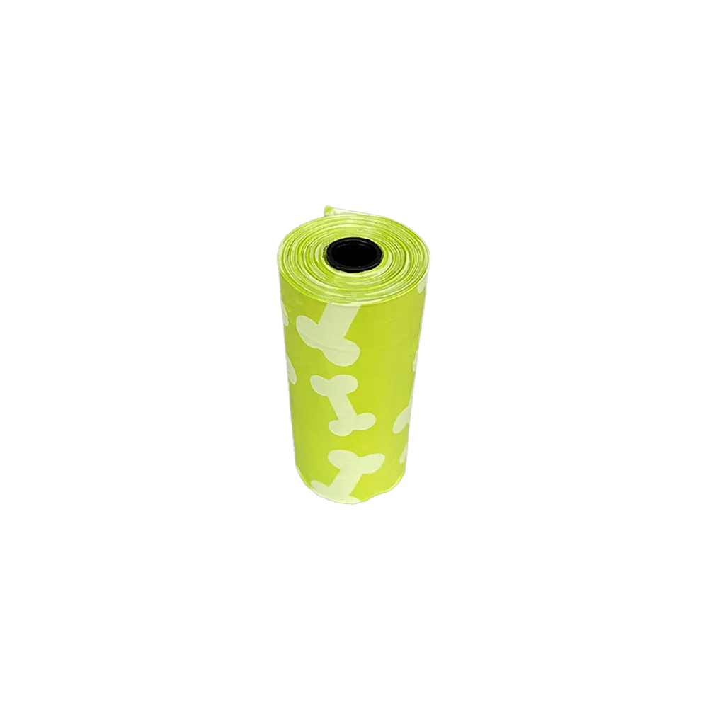 Rollito pequeño de Bolsas Para Heces de M-Pets es de color verde limón y tiene un print de huesitos blancos.