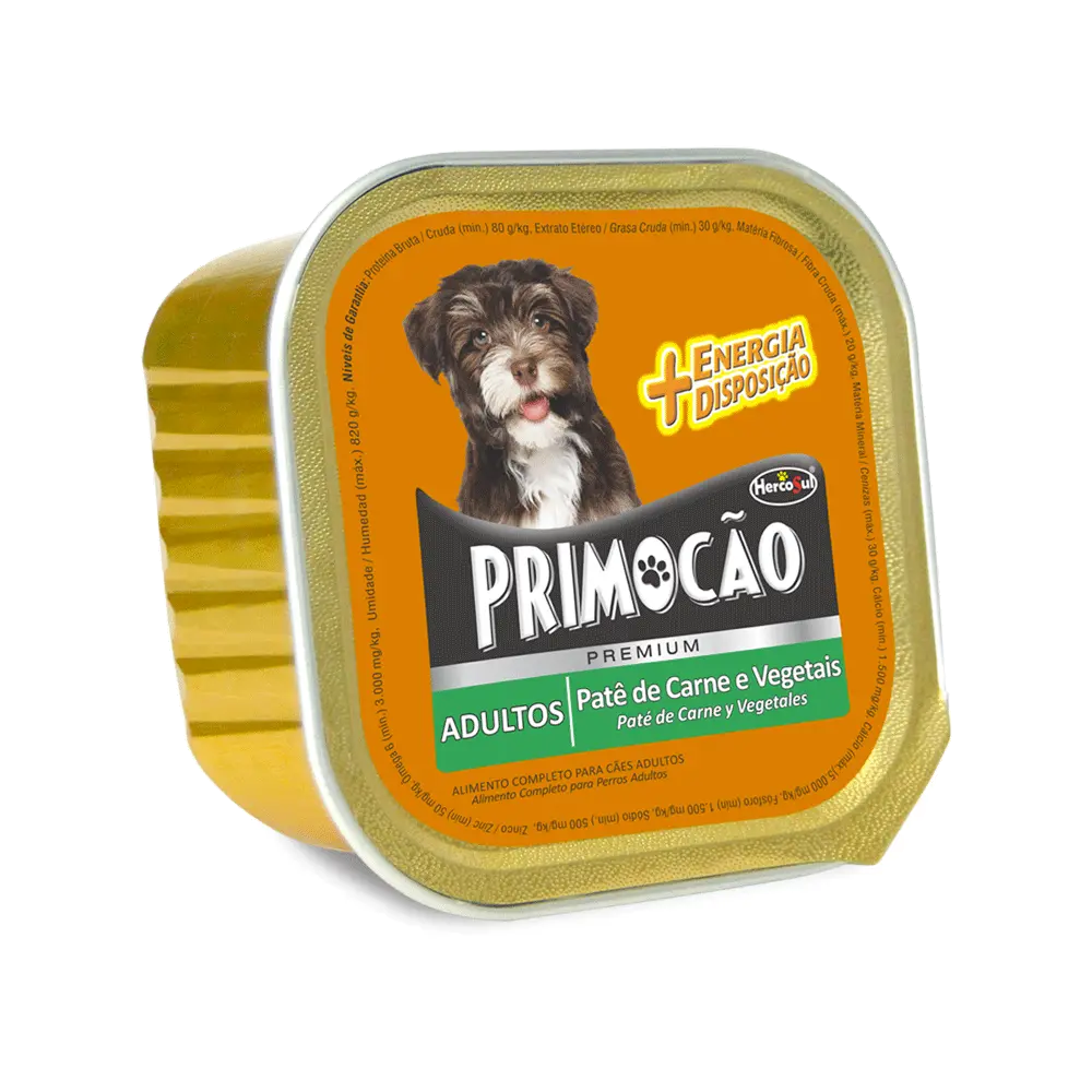 Imagen de lata de alimento húmedo Primocao Pate de Carne y Vegetales en su presentación de 300 gramos. Es de color bronce y tiene una etiqueta naranja en la tapa con la imagen de un perro negro y blanco encima del logo de la marca.