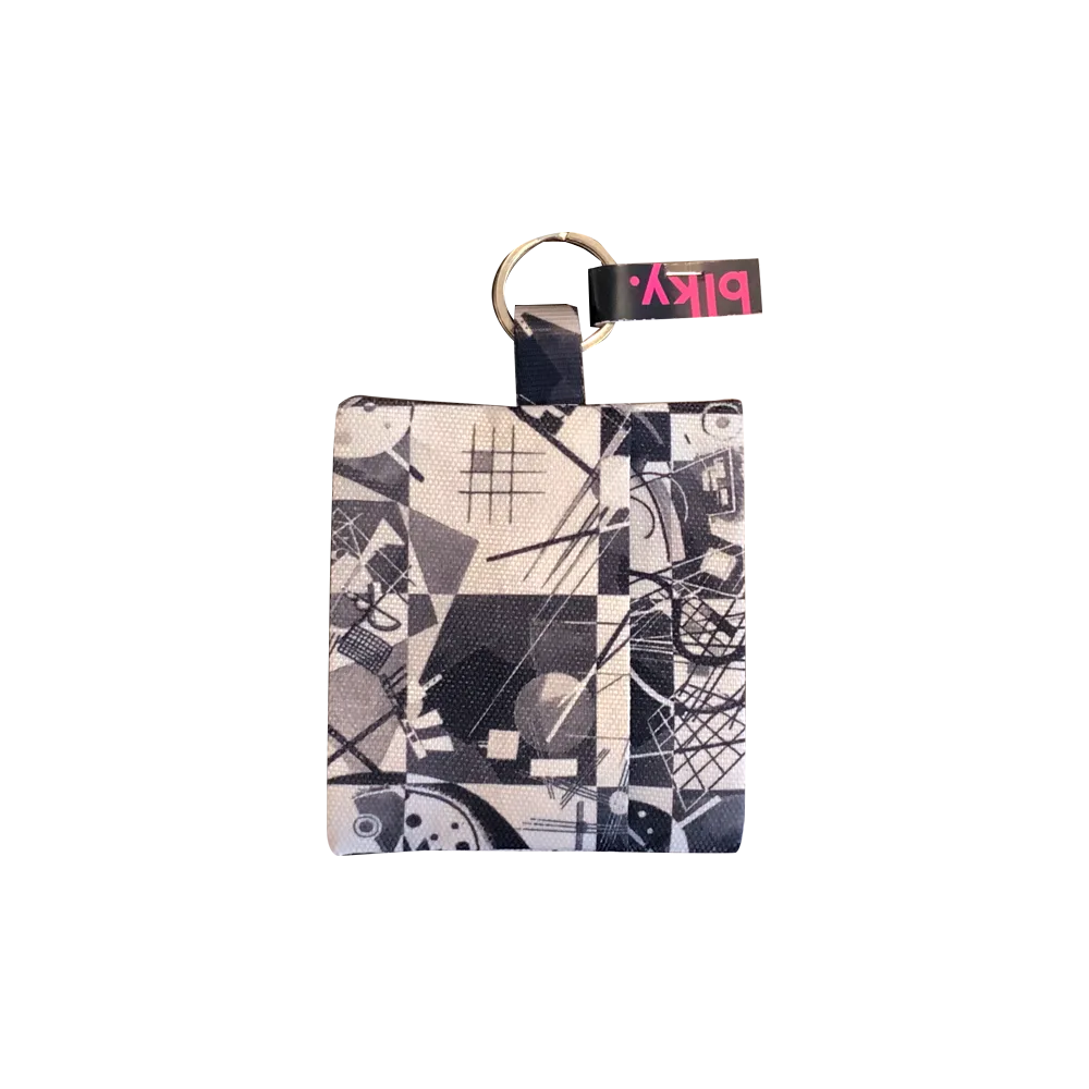 Sobre Porta Bolsas Para Paseo Blky con un estampado geométrico en blanco y negro