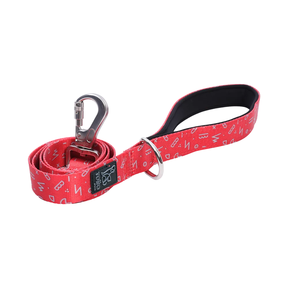 Correa para perros y gatos talla S modelo Odye de la marca Totto. Es de color rojo/rosado oscuro con un patrón geométrico blanco.