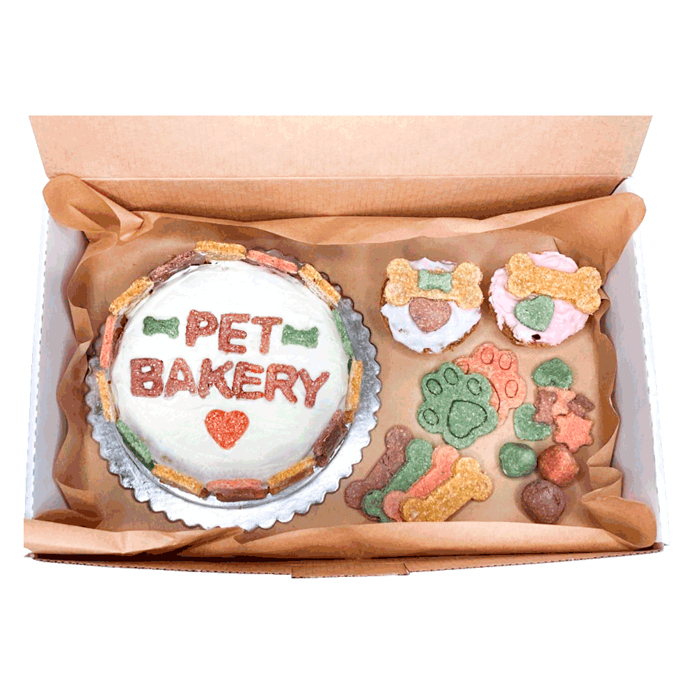 Imagen de Roccobox Grande Pet Bakery que contiene una torta grande, un pack de galletitas y dos muffins para perro 