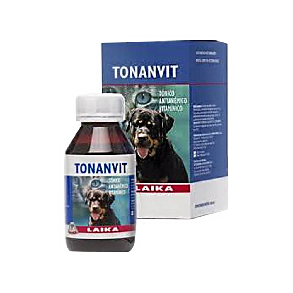 Frasco marron oscuro con tapa blanca y una etiqueta azul con un perro labrador y un gato de fondo, alado está la caja de cartón con el mismo diseño de la etiqueta del frasco, es el Tónico Tonanvit Laika, un suplemento Vitamínico y Antianémico para peros y gatos