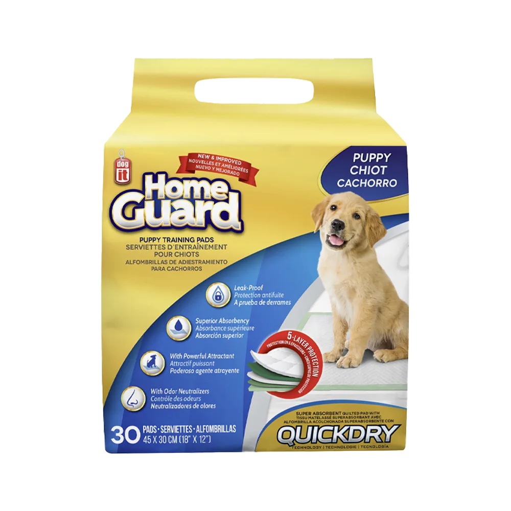 Empaque amarillo con detalles azules y un cachorro labrador en la portada. Son los Tapetes Absorbentes Home Guard para Cachorros. 