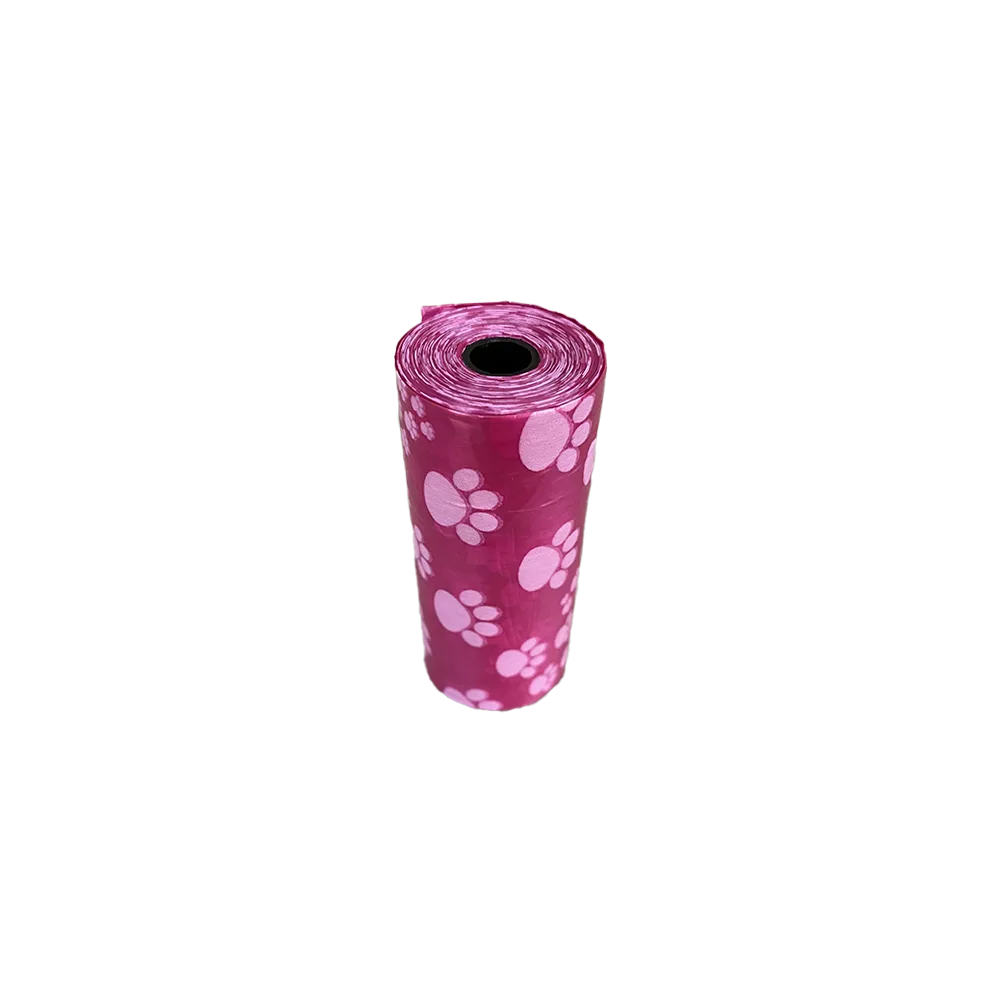 Rollito pequeño de Bolsas Para Heces de M-Pets es de color rosado y tiene un print de patitas blancas.