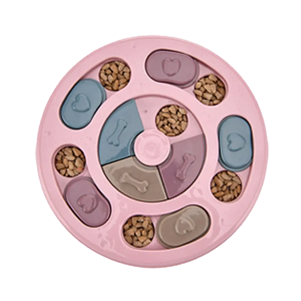 Rompecabezas de comida para mascotas color rosa pastel, es redondo y tiene compartimientos para esconder la comida.