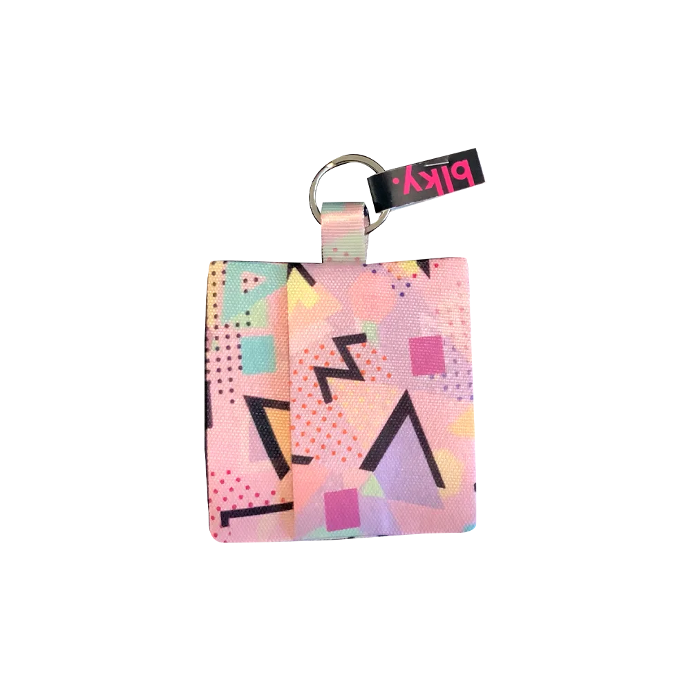 Sobre Porta Bolsas Para Paseo Blky con un estampado geométrico con tonos pasteles